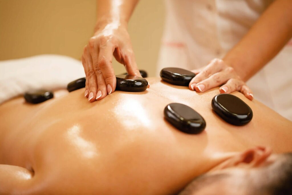 Benefits of Deep Tissue Massage for Office Workers in Delhi NCR hot stone therapy
